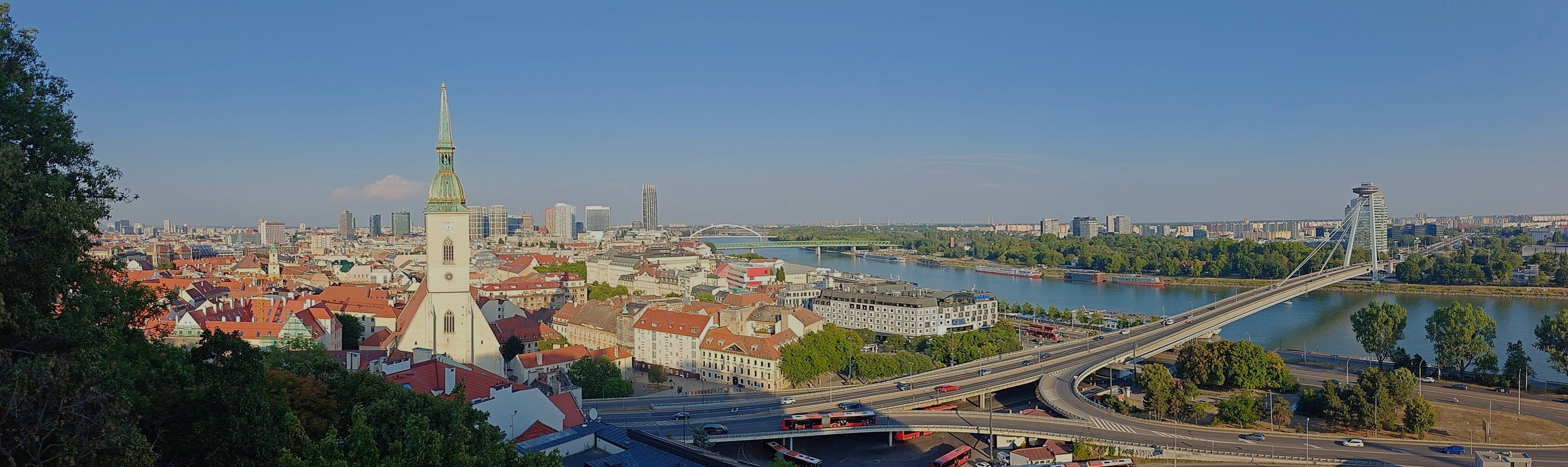 View from Bratislava Castle over the Old Town rooftops toward the downtown skyscrapers