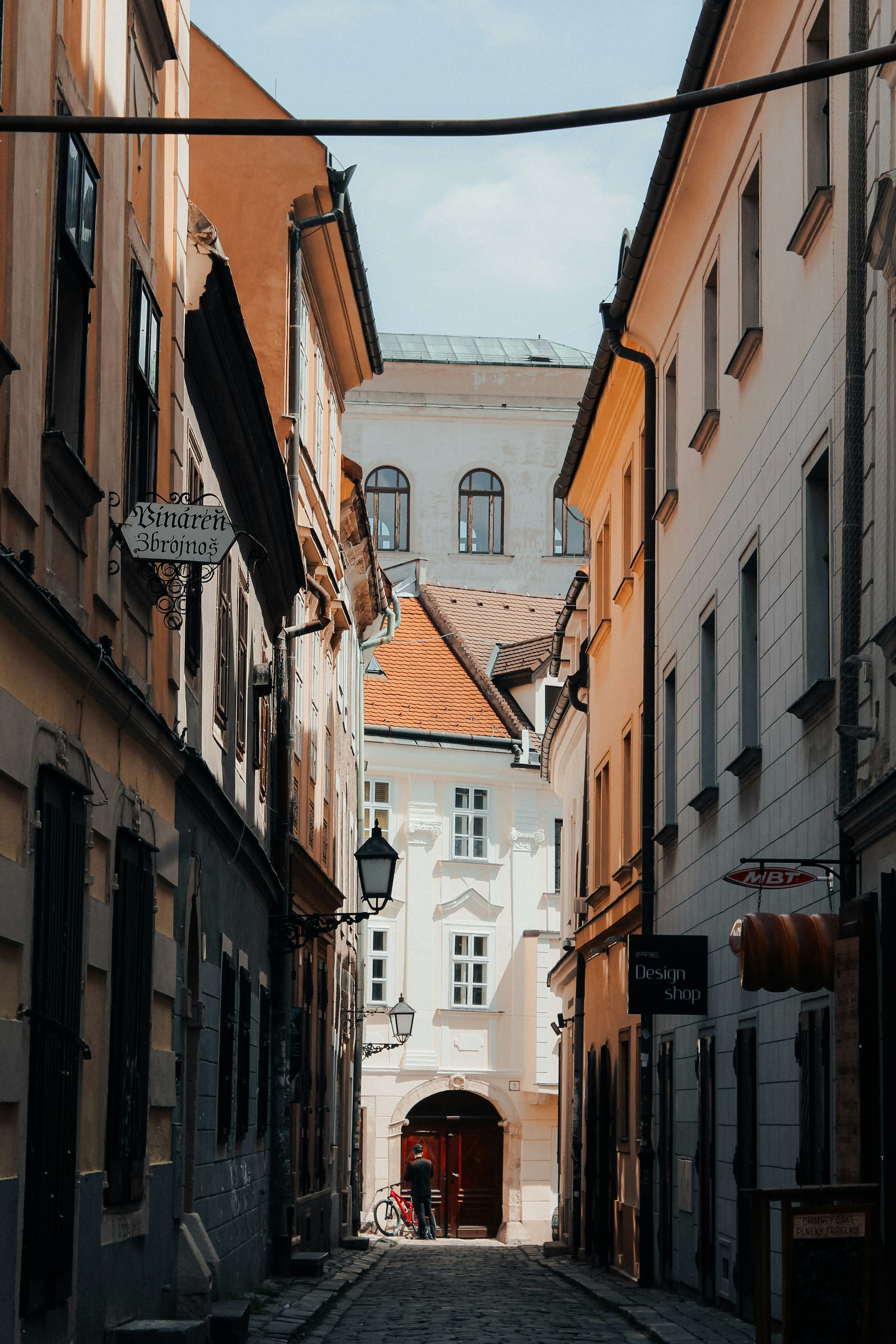 Kapitulská Street, a narrow medieval lane with buildings on both sides