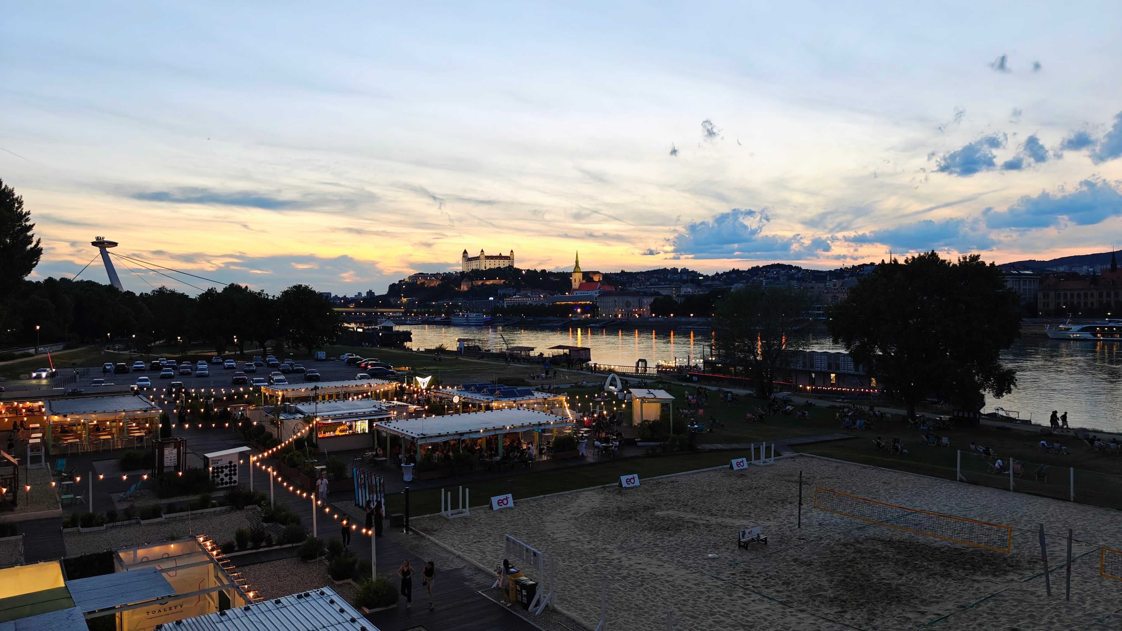 Tyršovo nábrežie at sunset with a view of Bratislava Castle and the Danube
